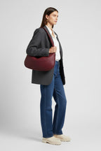 Bolso Redondo de Piel Vegana con Diseño Trenzado y Cremallera 9