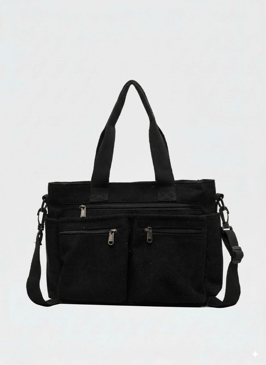 Bolso tote de pana negro con compartimento amplio y cremallera, asas y correa ajustable