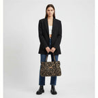 Bolso tipo tote de cuero sintético con estampado leopardo y asas marrones con cadena