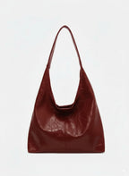 Bolso de cuero sintético burdeos tipo hobo con asa corta