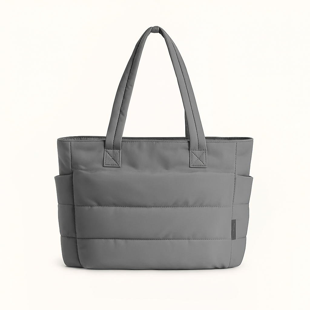 Bolso de hombro acolchado gris con asas largas y bolsillo frontal