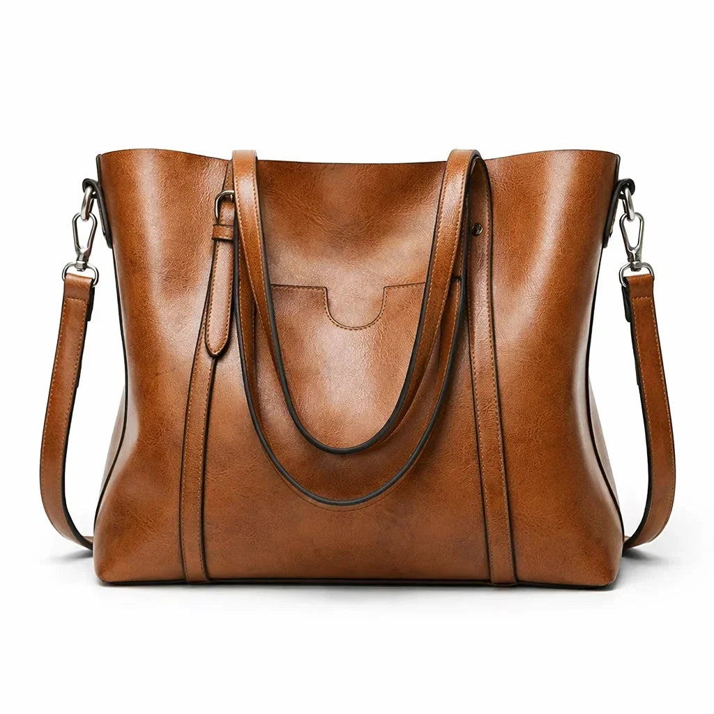 Bolso de hombro marrón con doble asa, bandolera extraíble y bolsillo frontal