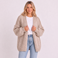 Cárdigan oversize abierto gris beige, mangas abullonadas y tejido de punto