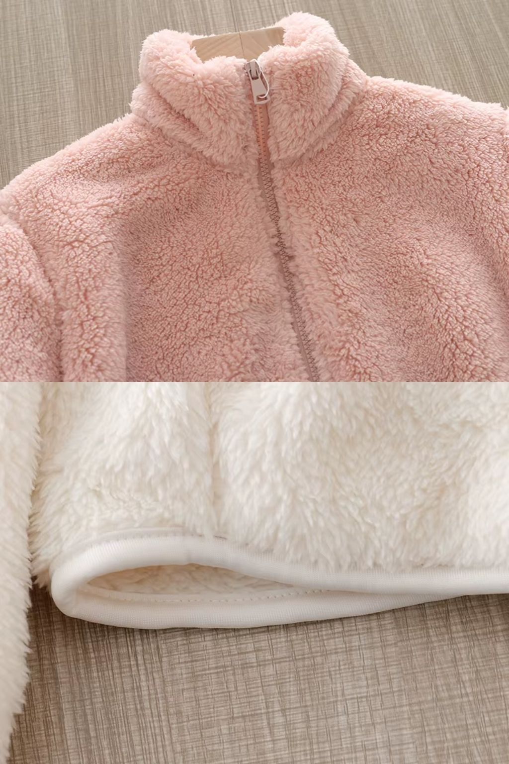Chaqueta de pelo suave rosa con cremallera y cuello alto, con acabado aterciopelado