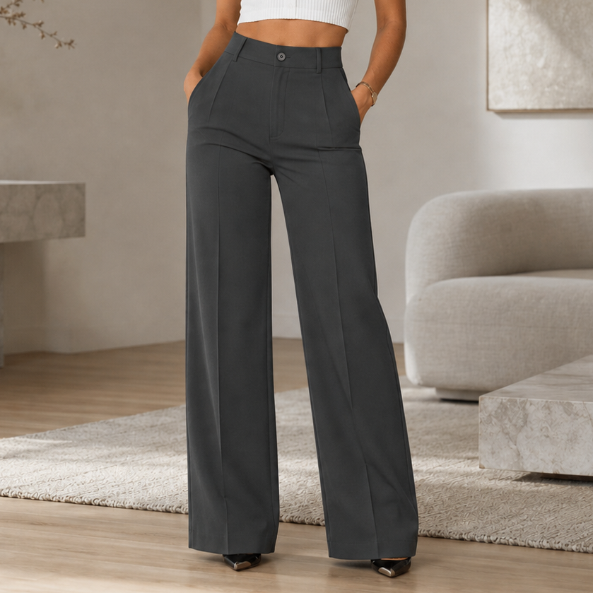 Pantalón ancho gris oscuro de tiro alto, con pinzas frontales y bolsillos laterales.