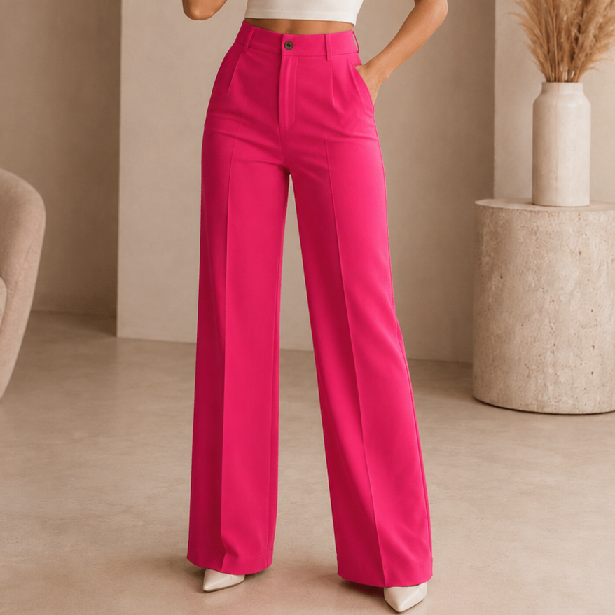 Pantalón ancho rosa intenso de tiro alto, con pinzas frontales y bolsillos laterales.